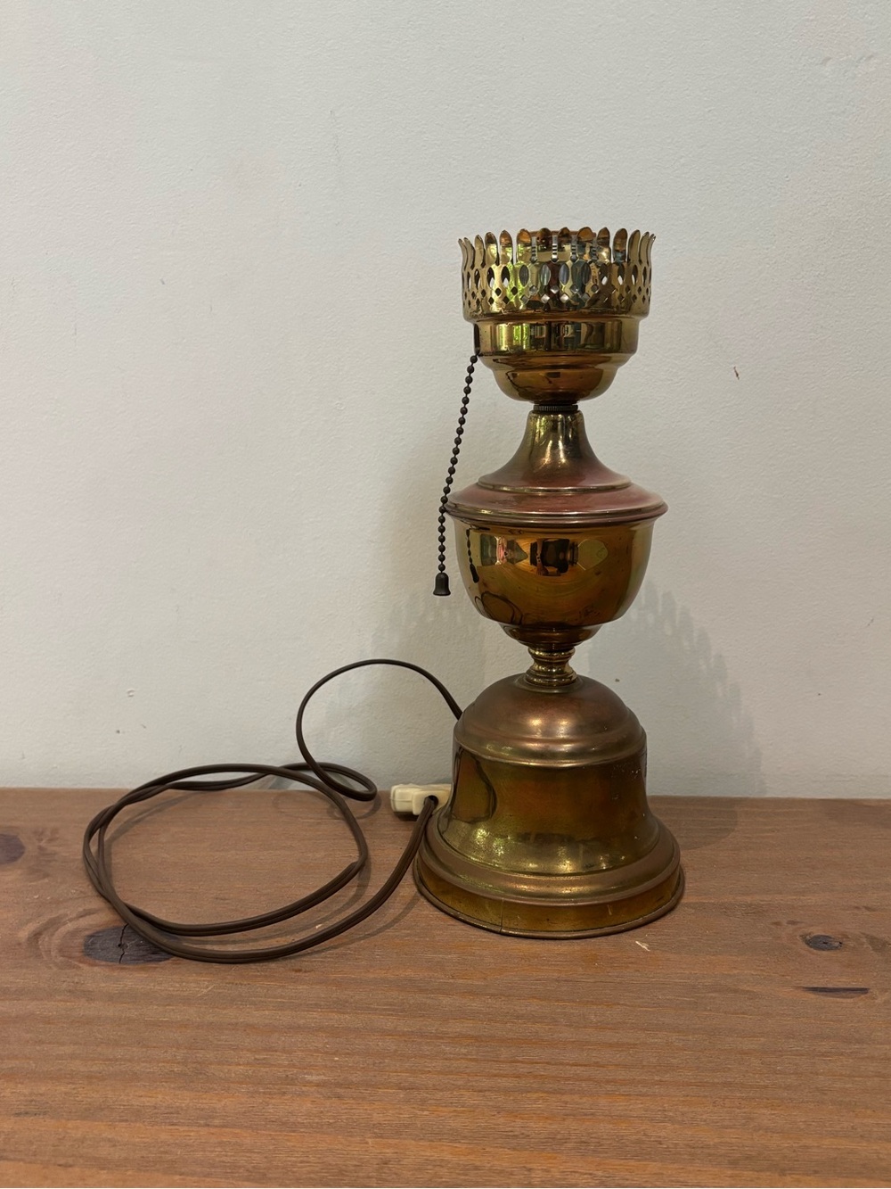 Antique brass kerosene lamp converted to an electric lamp base